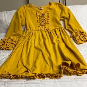 Mustard colored dress with ruffle details